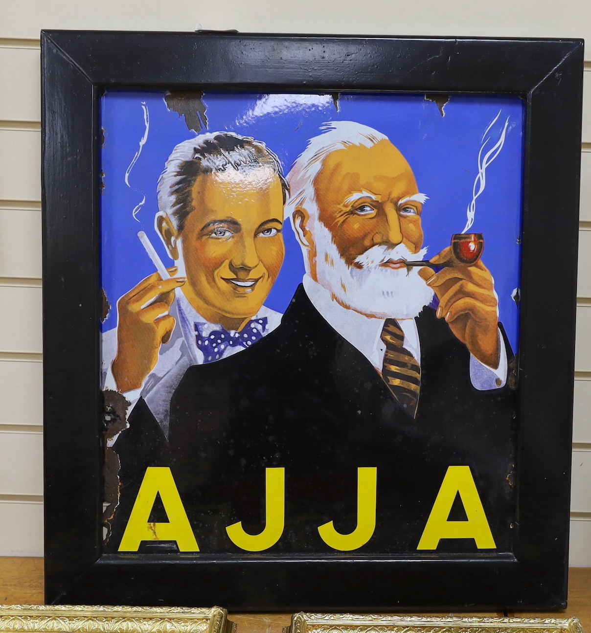 An enamelled advertising sign, AJJA. 72 x 64cm overall
